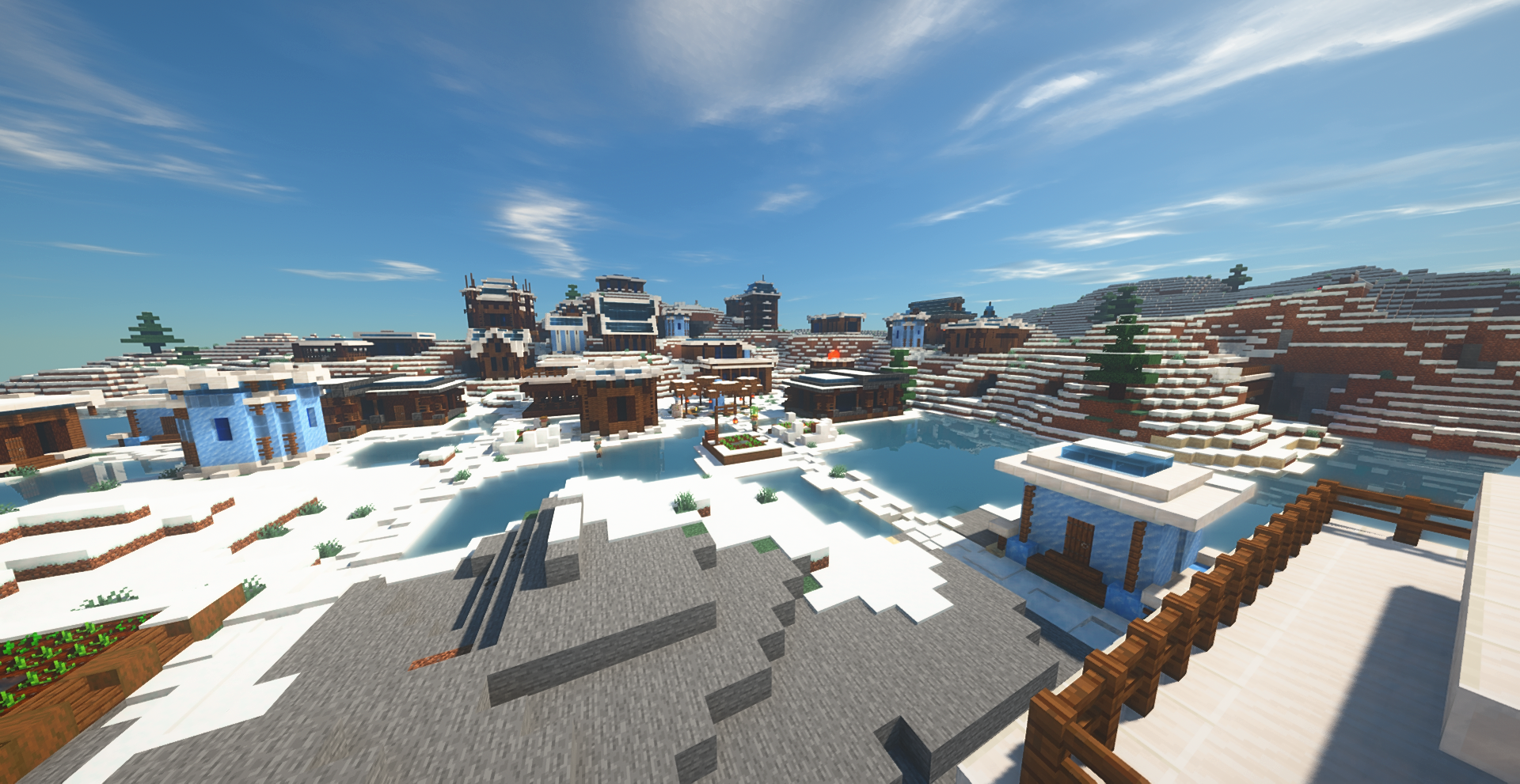 Deuxième vue d’un village enneigé, depuis un autre angle, mettant en lumière la disposition soignée et les variations de structure.