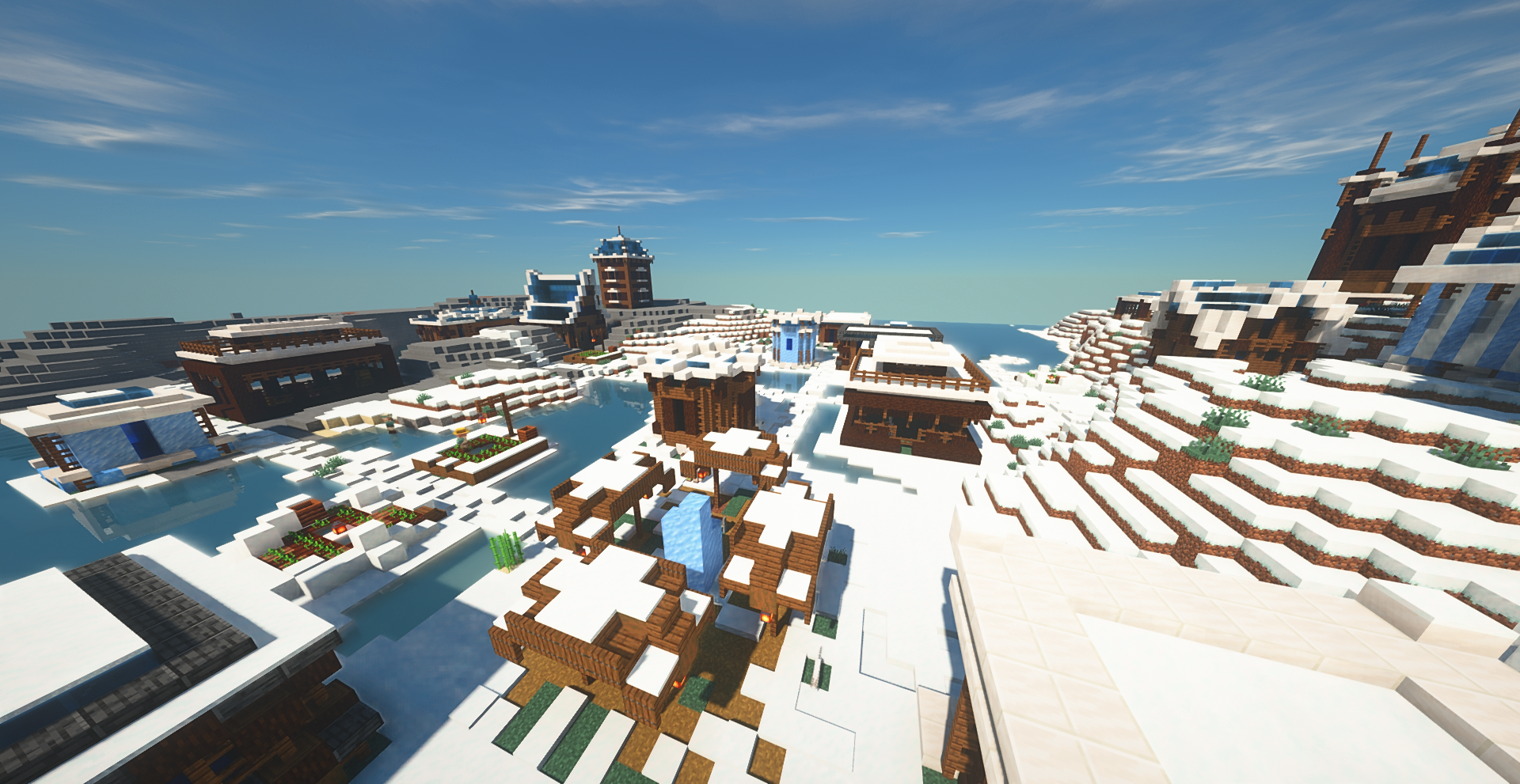Vue d’ensemble d’un village dans la toundra neigeuse, avec des toits enneigés, des bâtiments robustes et une ambiance hivernale marquée.
