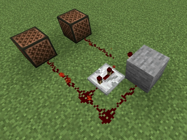 Deux blocs musicaux reliés à une horloge en redstone pour jouer en alternance dans Minecraft.