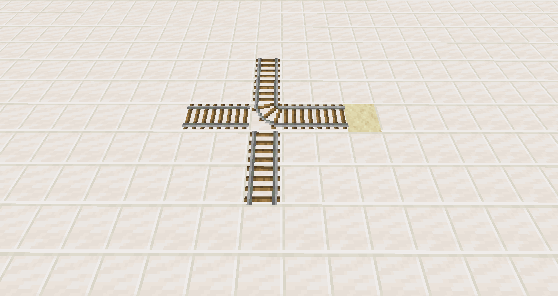 Illustration de la règle du sud-est dans Minecraft, montrant comment la courbe d’un rail détermine la direction du wagonnet.