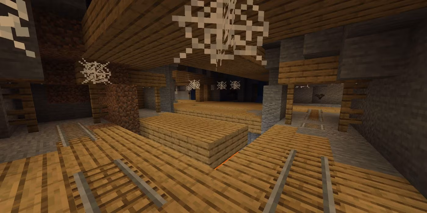 Une mine abandonnée comportant des rails déjà en place.