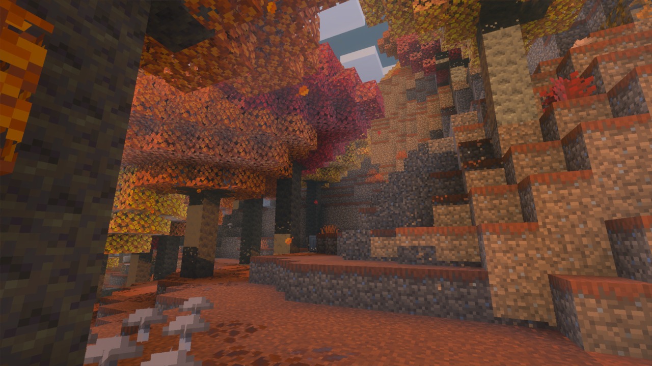 Forêt tachetée dans Minecraft avec des peupliers aux feuilles orange et rouges