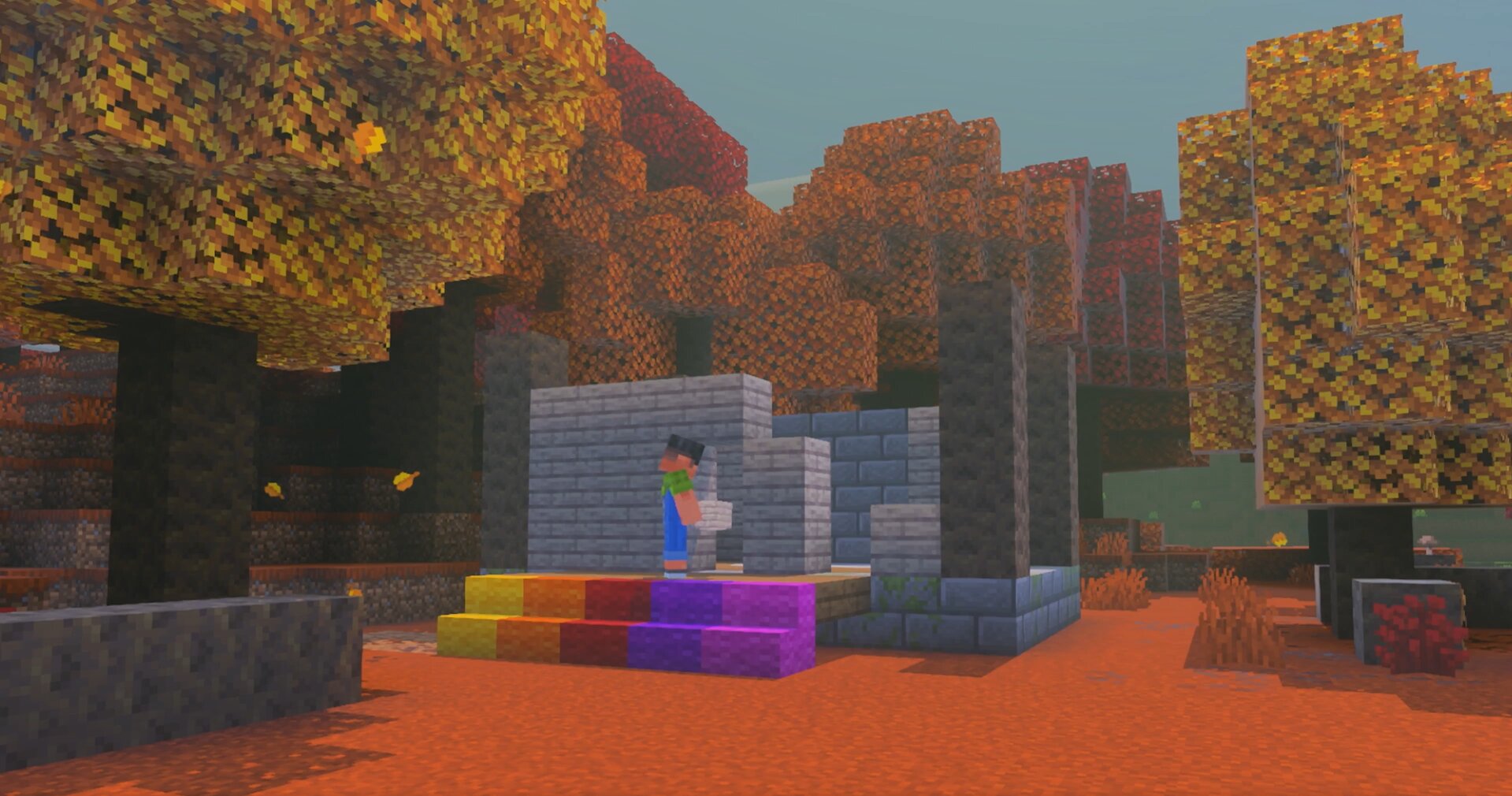 Construction en pierre dans une forêt tachetée Minecraft entourée de peupliers colorés