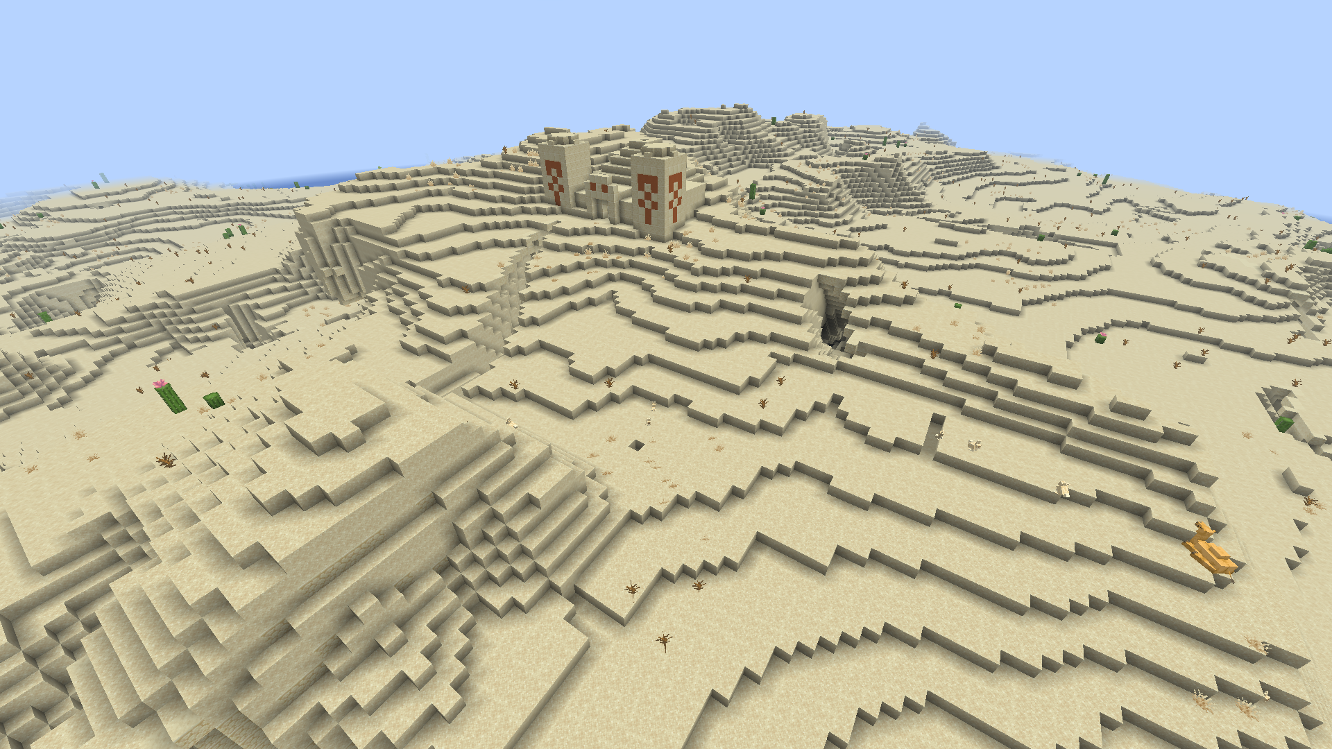 Grande étendue de sable et de dunes dans le biome désert de Minecraft.