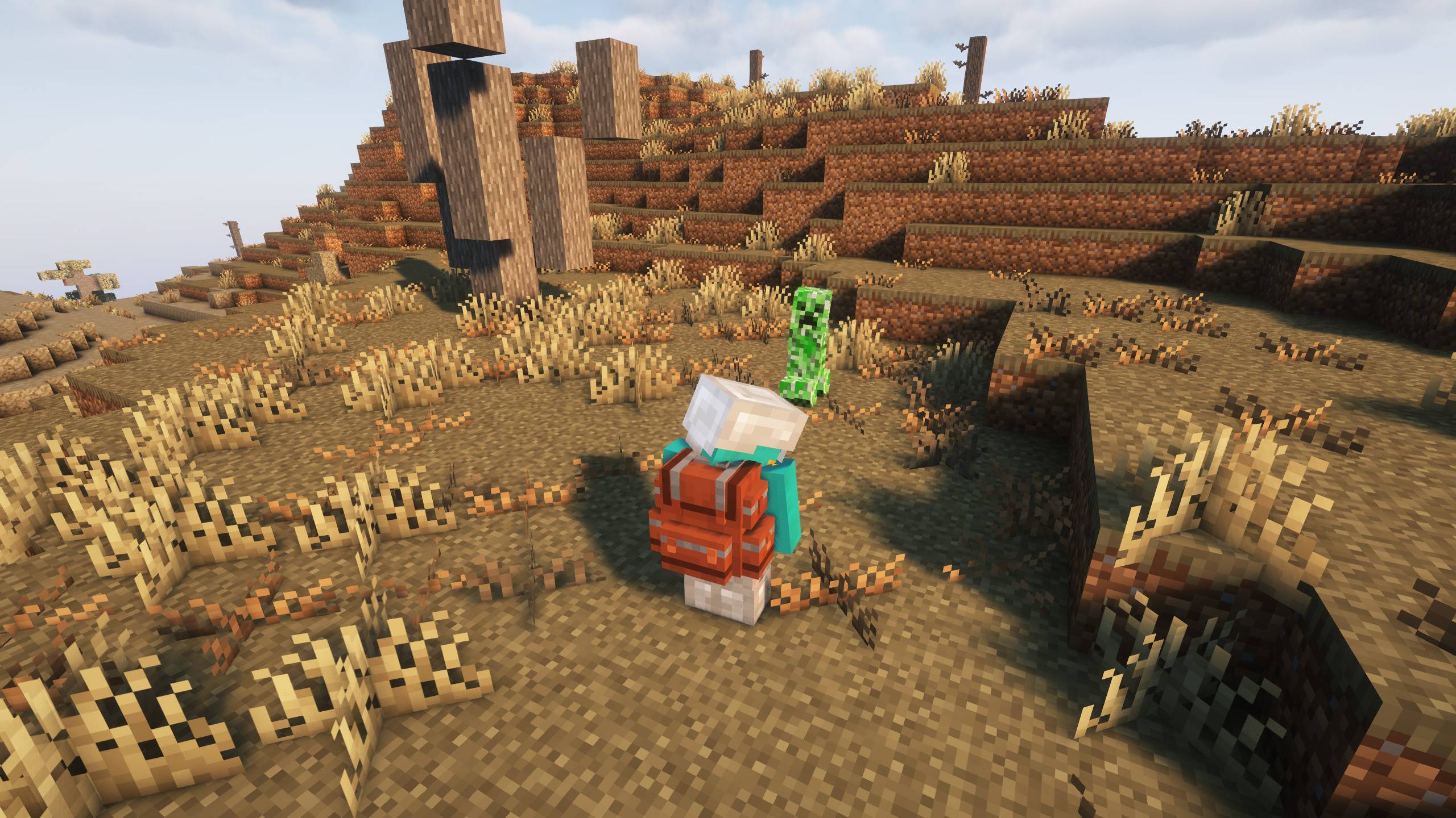 Paysage Minecraft exploré avec le modpack More Realistic, montrant une nature plus vivante et détaillée