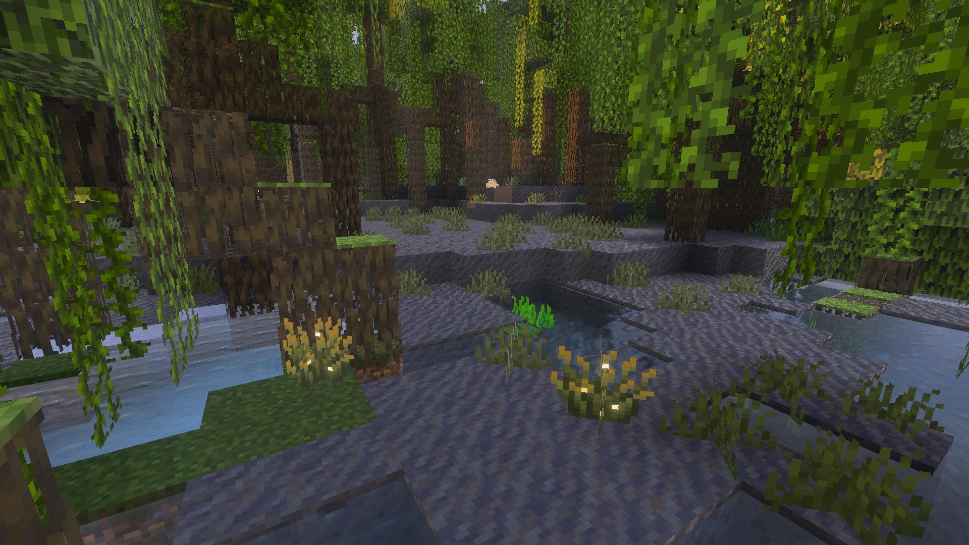 Intérieur d’un marais à mangroves dans Minecraft, entre racines de palétuvier, boue et eau.