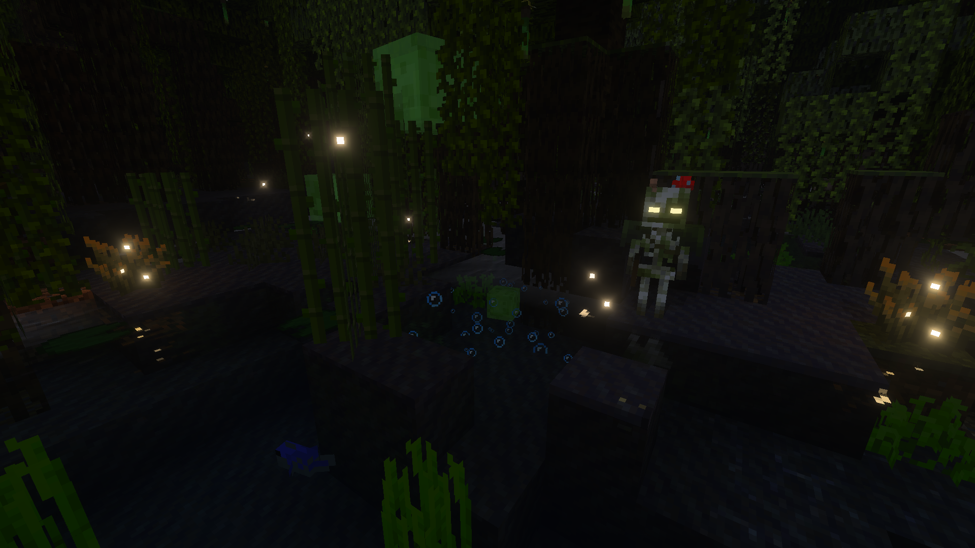Slimes et embourbés dans un marais à mangroves de Minecraft, la nuit.
