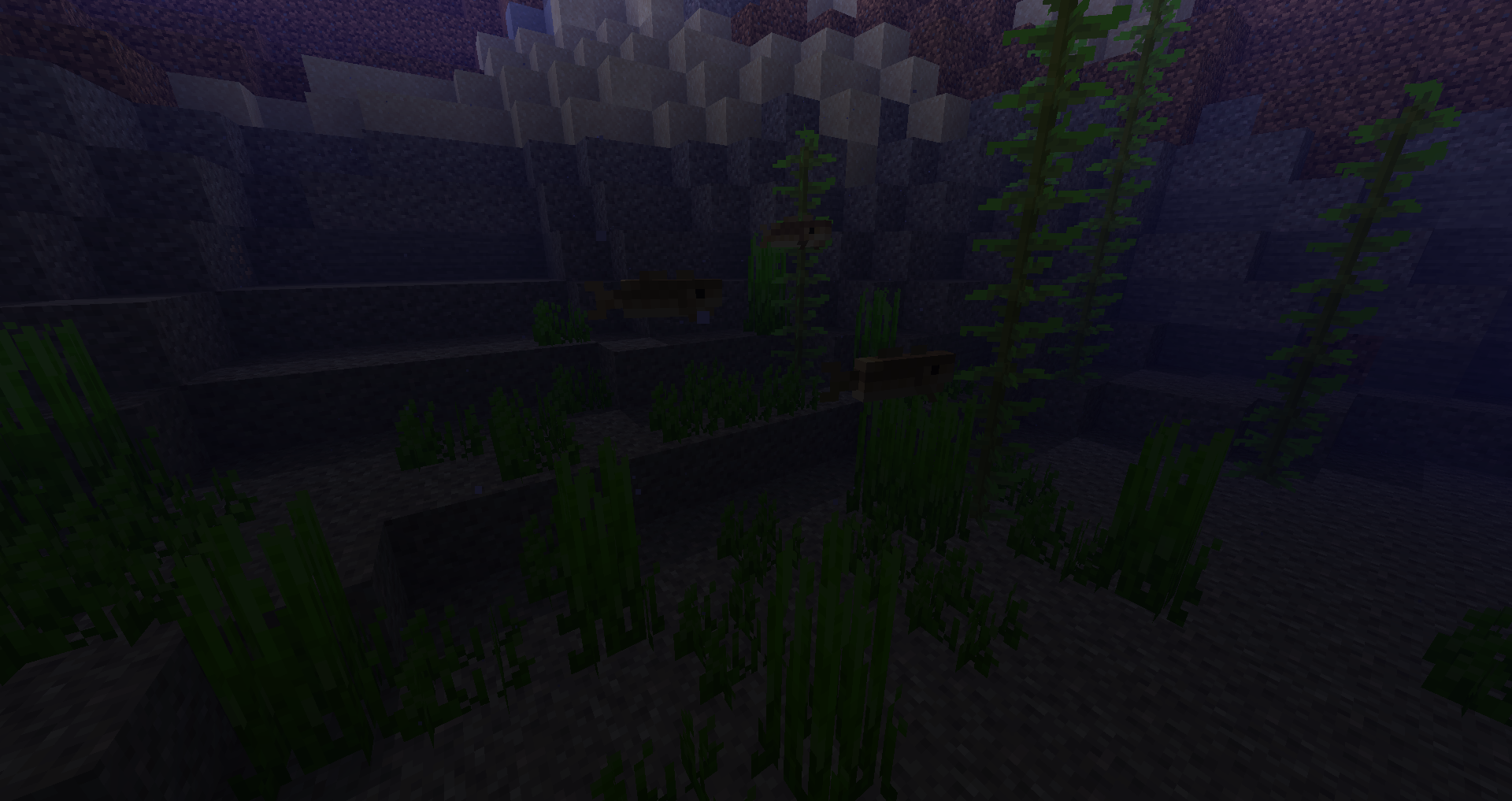 Groupe de morues nageant dans un océan de Minecraft.