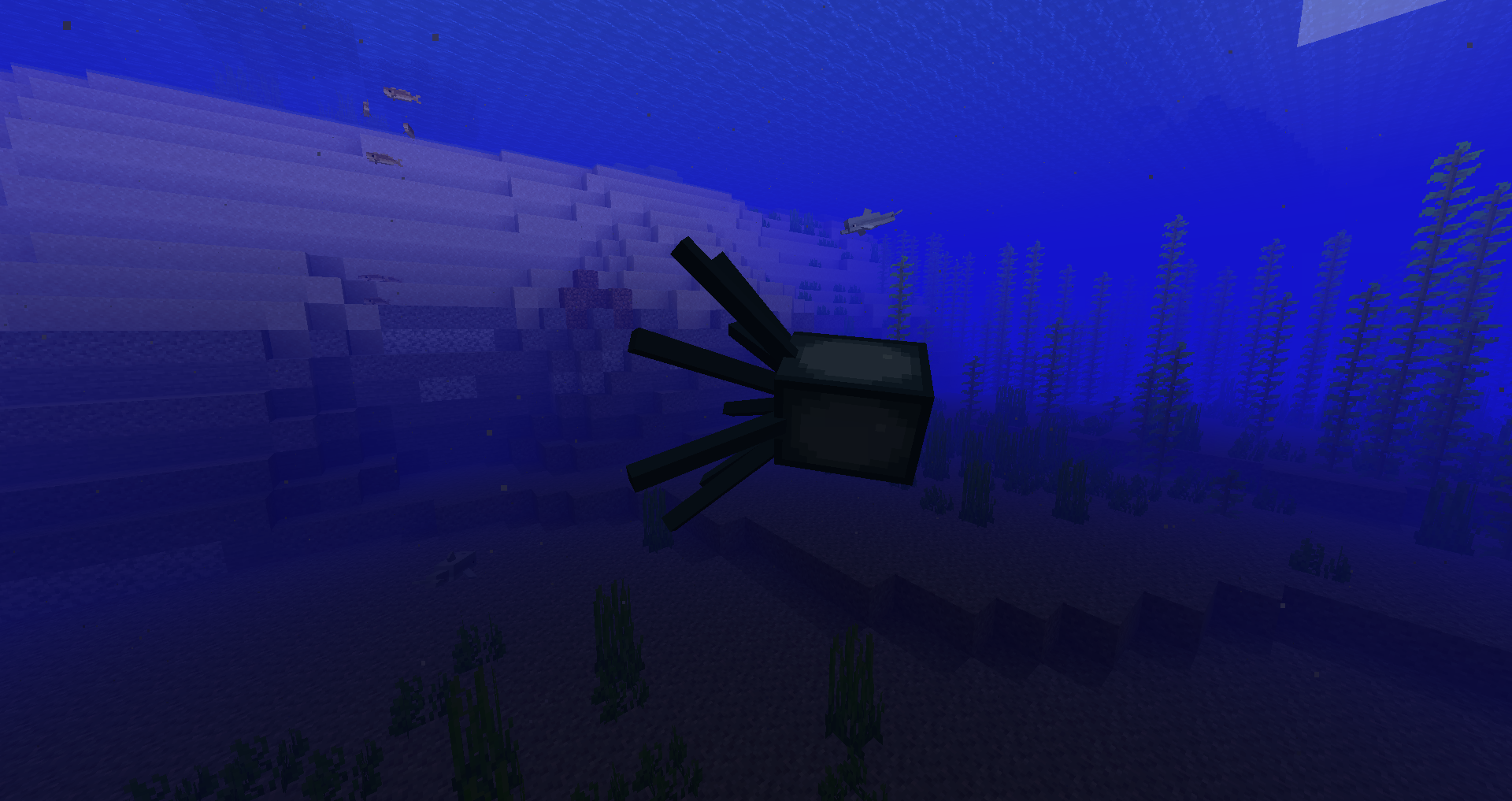 Poulpes nageant dans une zone océanique de Minecraft.