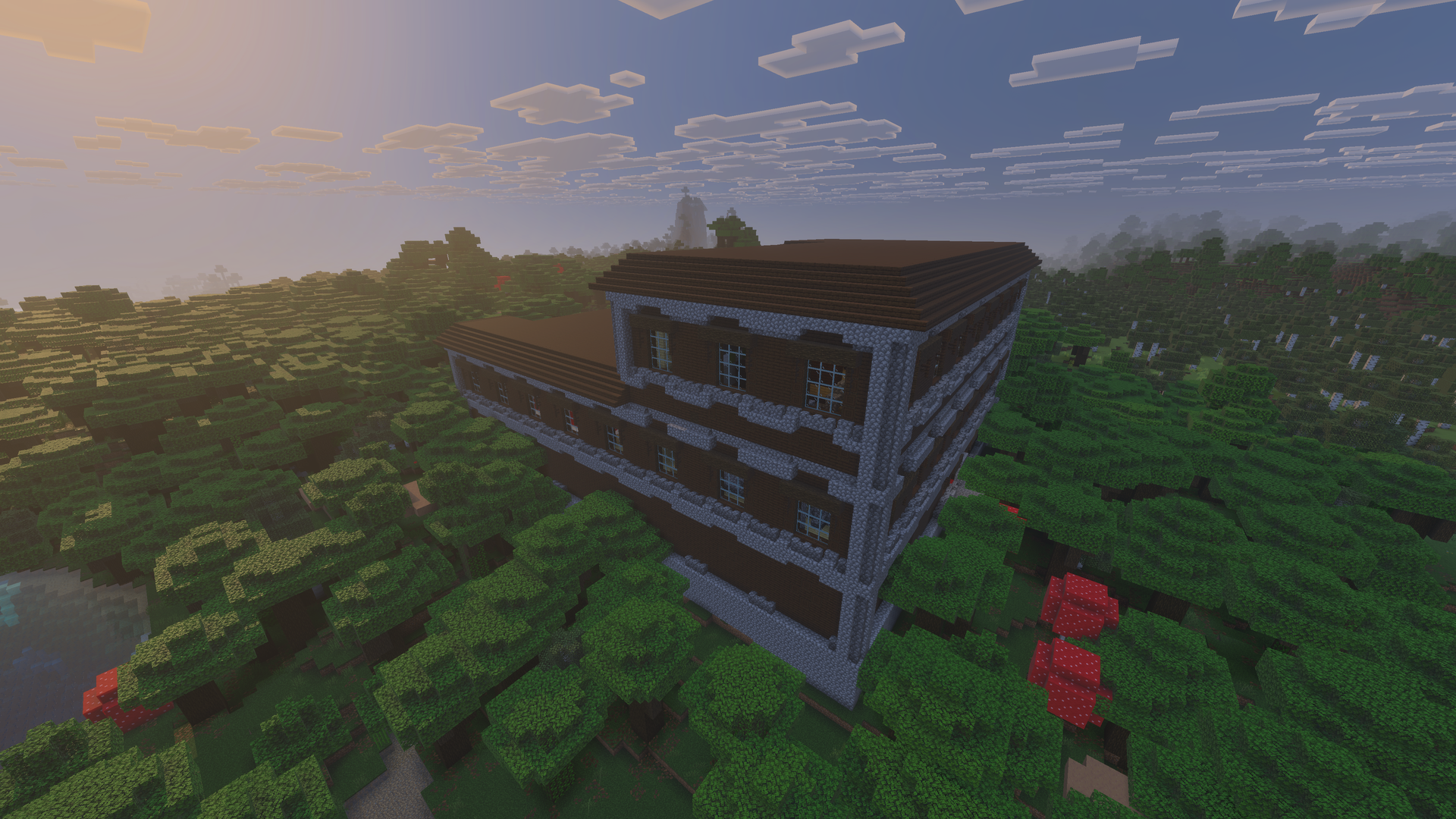 Manoir des bois au milieu d’une forêt sombre dans Minecraft.