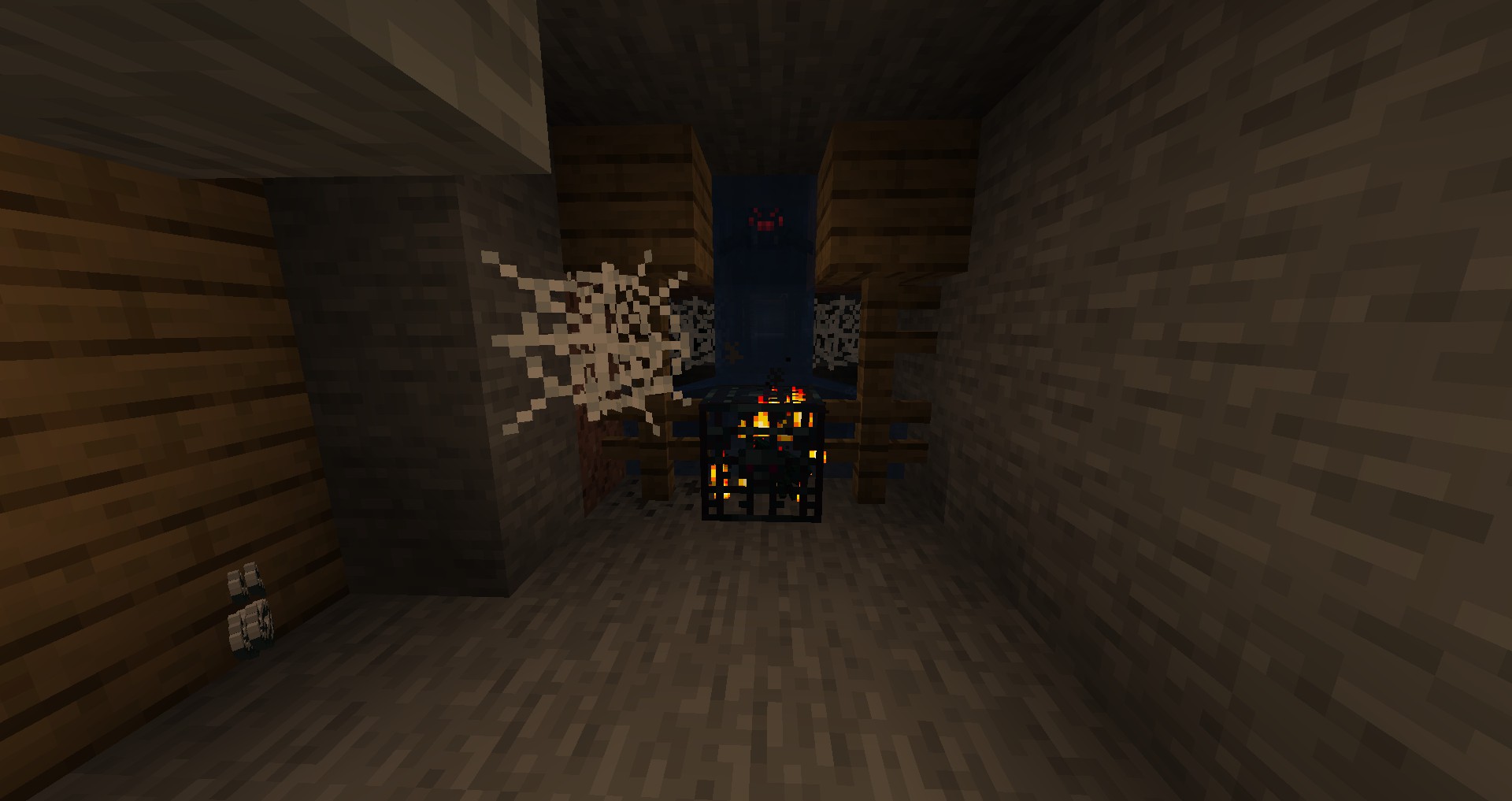 Araignée venimeuse dans un puits de mine Minecraft Araignée venimeuse dans un puits de mine abandonné de Minecraft, près de toiles d’araignée.