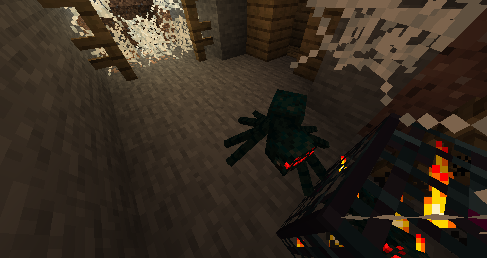 Générateur d’araignées venimeuses Minecraft Générateur d’araignées venimeuses entouré de toiles dans un puits de mine de Minecraft.